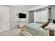 This bedroom offers a spacious layout, a platform bed, modern decor and plenty of natural light at 2395 Dalewood Ave, North Las Vegas, NV 89086