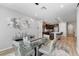 Bright dining area with stylish furniture, modern art, and open layout connecting to the kitchen at 2395 Dalewood Ave, North Las Vegas, NV 89086