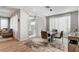 Bright dining area adjacent to sliding doors, flowing into a spacious seating area and featuring a stylish rug at 2395 Dalewood Ave, North Las Vegas, NV 89086