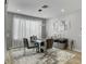 Elegant dining area with modern table, stylish chairs, and natural light, perfect for Gathering meals at 2395 Dalewood Ave, North Las Vegas, NV 89086