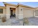 Inviting front entrance with stone pathway, dark entry door and two car garage at 2395 Dalewood Ave, North Las Vegas, NV 89086