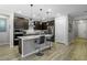 Charming kitchen features modern stainless steel appliances and breakfast bar at 2395 Dalewood Ave, North Las Vegas, NV 89086