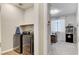 Convenient laundry room with washer and dryer at 2395 Dalewood Ave, North Las Vegas, NV 89086