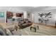 Living room and kitchen featuring hardwood floors and open-concept design at 2395 Dalewood Ave, North Las Vegas, NV 89086