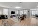 Spacious living room with lots of natural light and entertainment center at 2395 Dalewood Ave, North Las Vegas, NV 89086