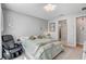 Comfortable bedroom boasts soothing decor, soft carpet, and plenty of natural light, creating a tranquil space at 2395 Dalewood Ave, North Las Vegas, NV 89086