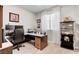 Home office featuring a built-in desk, a comfortable chair and a window for natural light at 2395 Dalewood Ave, North Las Vegas, NV 89086