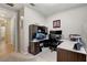 Home office area featuring a built-in desk, a comfortable chair and neutral decor at 2395 Dalewood Ave, North Las Vegas, NV 89086