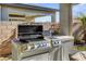 Outdoor kitchen with a grill and counter space at 2395 Dalewood Ave, North Las Vegas, NV 89086