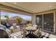Outdoor patio featuring a grill, table, chairs, and mini-golf at 2395 Dalewood Ave, North Las Vegas, NV 89086
