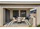 Covered outdoor patio with a grill, table, and chairs at 2395 Dalewood Ave, North Las Vegas, NV 89086