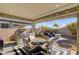 Outdoor patio with a table, chairs, and grill at 2395 Dalewood Ave, North Las Vegas, NV 89086