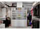 Spacious walk-in closet with custom built-in shelving and clothing racks for optimal organization at 2395 Dalewood Ave, North Las Vegas, NV 89086