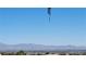 Scenic view of the city from the home with mountains in the distance and a clear blue sky at 2904 Bow Bridge Dr, Las Vegas, NV 89134