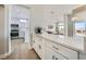 Contemporary kitchen with white cabinets, granite countertop, and modern appliances at 2904 Bow Bridge Dr, Las Vegas, NV 89134