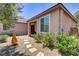 Charming side yard features desert landscaping and a covered patio, creating a tranquil outdoor retreat at 3906 Jacob Lake Cir, Las Vegas, NV 89118