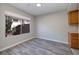 Bright dining area with wood-look floors and large window at 4338 Caliente St # 4, Las Vegas, NV 89119