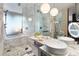 Spa-like bathroom with marble finishes and a soaking tub at 4381 W Flamingo Rd # 17318, Las Vegas, NV 89103