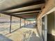 Spacious covered patio offers ample room for outdoor seating and relaxation with stone floor at 5132 Springland St, Las Vegas, NV 89146