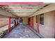 View of the covered patio with unique stone flooring and rustic design elements at 5132 Springland St, Las Vegas, NV 89146