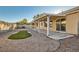 Covered patio, artificial turf, and gravel backyard at 5302 Azure View Ct, North Las Vegas, NV 89031