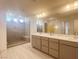 Spa-like bathroom with double vanity, large shower, and modern fixtures at 629 Soaring Wings Ave, Las Vegas, NV 89183