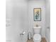 Small half bathroom with toilet and wall decor at 7053 Solana Ridge Dr, North Las Vegas, NV 89084