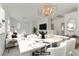 Bright dining room featuring a marble table and modern chandelier at 8139 Azure Falls Ct, Las Vegas, NV 89117