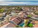 Aerial view of property and neighborhood, showcasing the pool and mountain views at 8608 Alfano Ct, Las Vegas, NV 89117