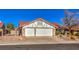 House exterior featuring a two-car garage and red tile roof at 8608 Alfano Ct, Las Vegas, NV 89117