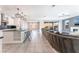 Modern kitchen with island, stainless steel appliances, and white cabinetry at 8648 Cloverbelle St, Las Vegas, NV 89166