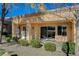 Back porch with stucco siding and desert landscaping at 8805 Litchfield Ave, Las Vegas, NV 89134