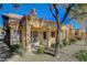Backyard view showcasing stucco siding, patio area, and desert landscaping at 8805 Litchfield Ave, Las Vegas, NV 89134