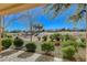 Gorgeous backyard view overlooking the green golf course, mature landscaping, and patio at 8805 Litchfield Ave, Las Vegas, NV 89134