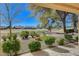 Beautiful backyard view overlooking the golf course, mature landscaping, and patio at 8805 Litchfield Ave, Las Vegas, NV 89134