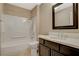 Bathroom features a shower-tub combo and single sink vanity at 8805 Litchfield Ave, Las Vegas, NV 89134
