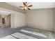 Spacious bedroom featuring neutral walls, carpet, ceiling fan, and ample natural light at 8805 Litchfield Ave, Las Vegas, NV 89134