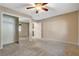 Mirrored closet bedroom with ceiling fan and carpeting at 8805 Litchfield Ave, Las Vegas, NV 89134