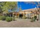 Exterior view of the home showcasing desert landscaping at 8805 Litchfield Ave, Las Vegas, NV 89134