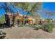 Exterior view of the home showcasing stucco siding, and desert landscaping at 8805 Litchfield Ave, Las Vegas, NV 89134