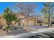 Charming single-story home features a well-manicured front yard, tiled roof, and two car garage at 8805 Litchfield Ave, Las Vegas, NV 89134