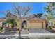 Attractive single-story home boasts a tiled roof, two car garage and gated front porch at 8805 Litchfield Ave, Las Vegas, NV 89134
