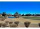 Peaceful view of the golf course with a pond and wildlife at 8805 Litchfield Ave, Las Vegas, NV 89134
