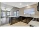 Beautiful kitchen with island, stainless steel appliances and breakfast bar seating at 8805 Litchfield Ave, Las Vegas, NV 89134
