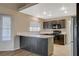 Well-lit kitchen with modern appliances, island, and ample counter space for food preparation at 8805 Litchfield Ave, Las Vegas, NV 89134