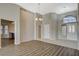 Open-concept living room with hardwood floors and dining area at 8805 Litchfield Ave, Las Vegas, NV 89134