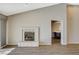 Bright living area with vaulted ceilings, fireplace, and modern flooring at 8805 Litchfield Ave, Las Vegas, NV 89134