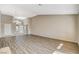 Large living room with wood-look flooring and neutral colors, offering a versatile space for living and entertaining at 8805 Litchfield Ave, Las Vegas, NV 89134