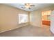 Bright bedroom with ceiling fan and ensuite bathroom access at 9742 Darlington Ct, Las Vegas, NV 89149