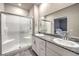 Bathroom with double vanity, granite countertop, and large walk-in shower at 10185 Sequoia Falls Pl, Las Vegas, NV 89149